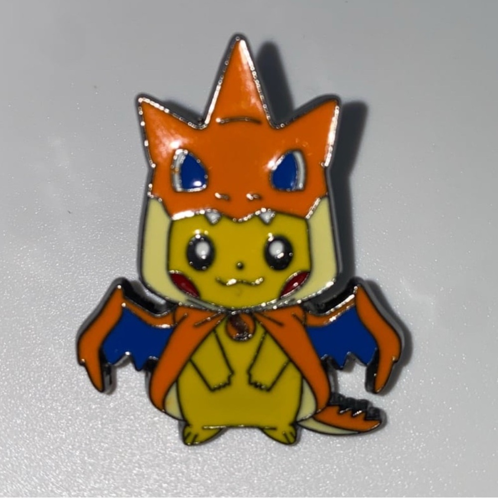 Mega Tokyo Japan pikachu charizard poncho pin Brooch brand new 1 inches tall - Picture 1 of 3